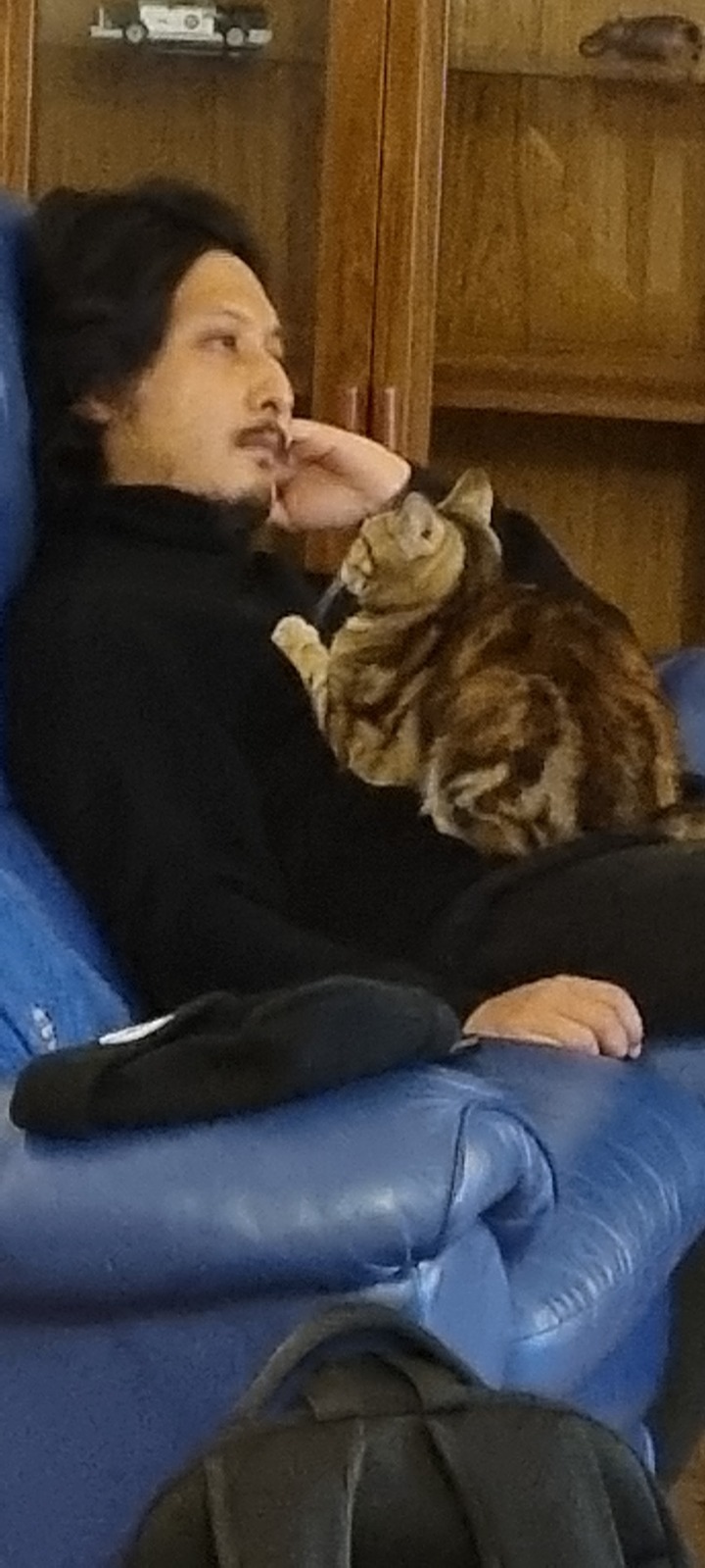 Avi at home with his cat